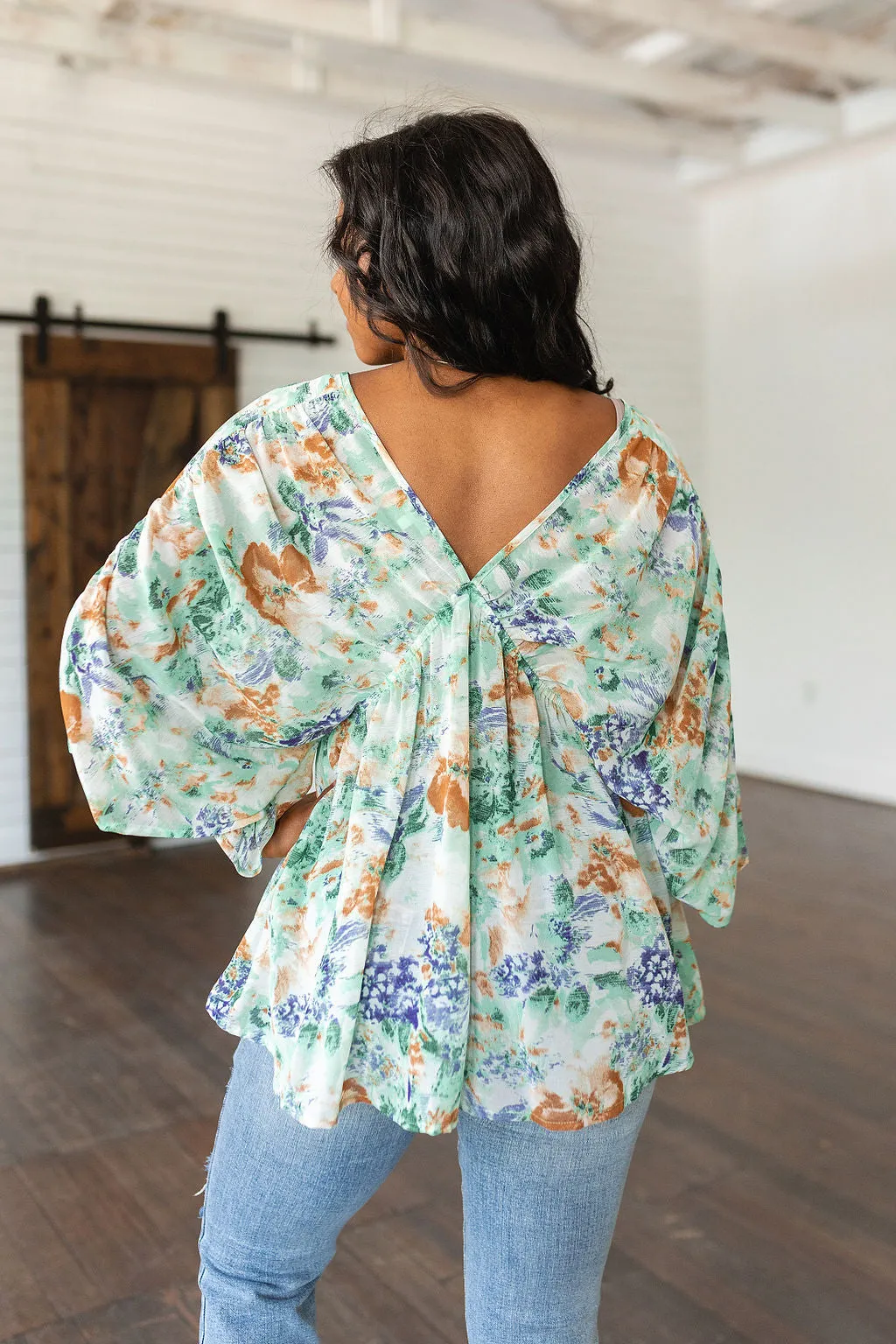 ONLINE EXCLUSIVE Fabled in Floral Draped Peplum Top in Ivory